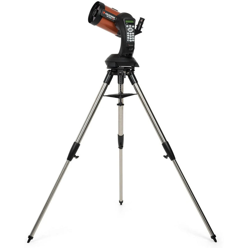 Celestron NexStar 5SE Schmidt-Cassegrain computerized telescope with red optical tube and adjustable tripod.
