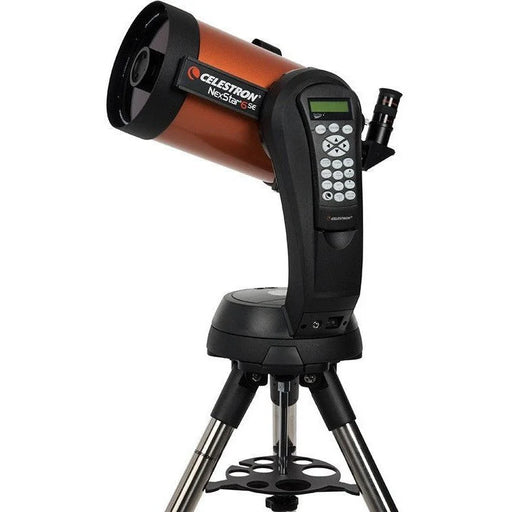 Celestron NexStar 6SE Schmidt-Cassegrain computerized telescope with red optical tube and mount for astronomy viewing.