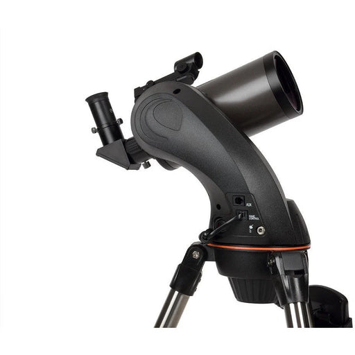 Celestron NexStar 90 SLT Maksutov Schmidt-Cassegrain computerized telescope setup with adjustable tripod and control panel.