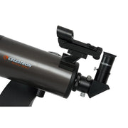 Celestron NexStar 90 SLT Maksutov computerized telescope with Schmidt-Cassegrain optics, mounted on tripod for stargazing.