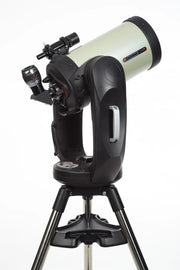 Celestron CPC Deluxe 925 EdgeHD Schmidt-Cassegrain computerized telescope with tripod and accessories, designed for astrophotography and stargazing.