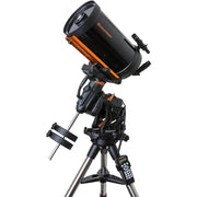 Celestron CGX 925 Schmidt-Cassegrain telescope with tripod and accessories, reflecting optical tube and dual mount setup.