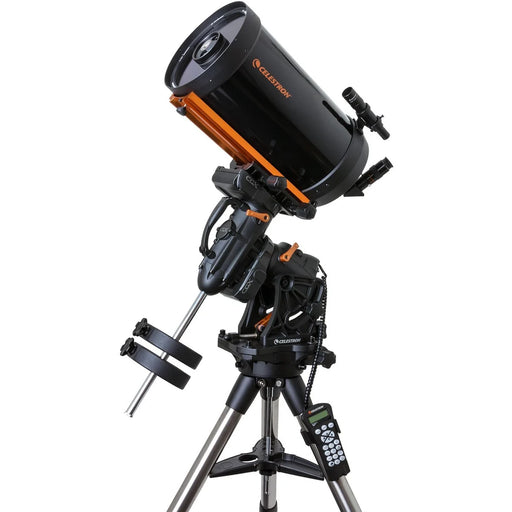 Celestron CGX 925 Schmidt-Cassegrain telescope with tripod and accessories, reflecting optical tube and dual mount setup.