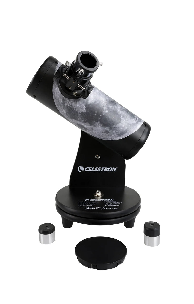 Celestron FirstScope Telescope from the Moon Signature Series showing the telescope and its accessories in a natural setting.