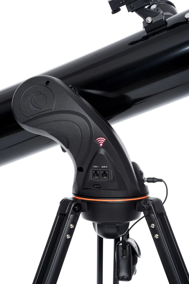 Celestron AstroFi 130 Wi-Fi Newtonian reflector telescope with tripod, showcasing its optical tube and control panel for stargazing.