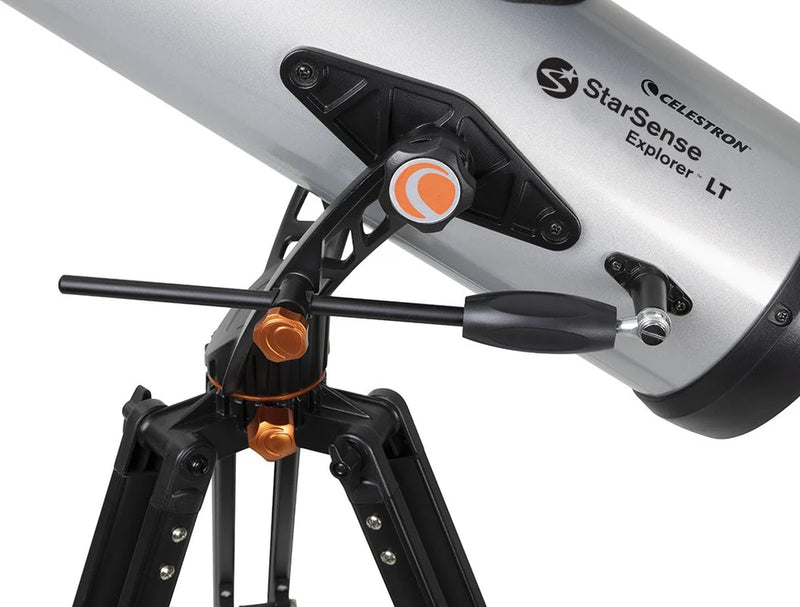 Celestron StarSense Explorer LT 114 reflector telescope with smartphone app, Newtonian design, mounted on a tripod for stargazing.