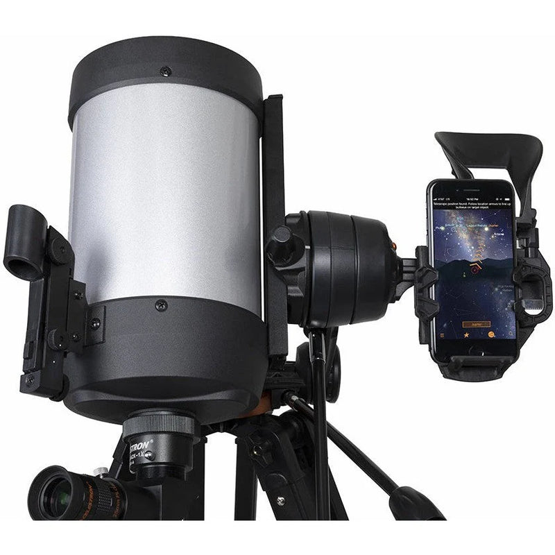 Celestron Starsense Explorer DX 5-inch SCT refractor telescope with smartphone app, mounted on a tripod for stargazing.