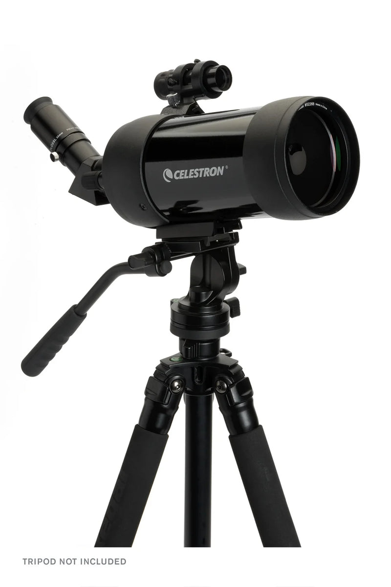 Celestron C90 Maksutov Cassegrain spotting scope with a sturdy tripod and lens cap, designed for detailed terrestrial and astronomical viewing.