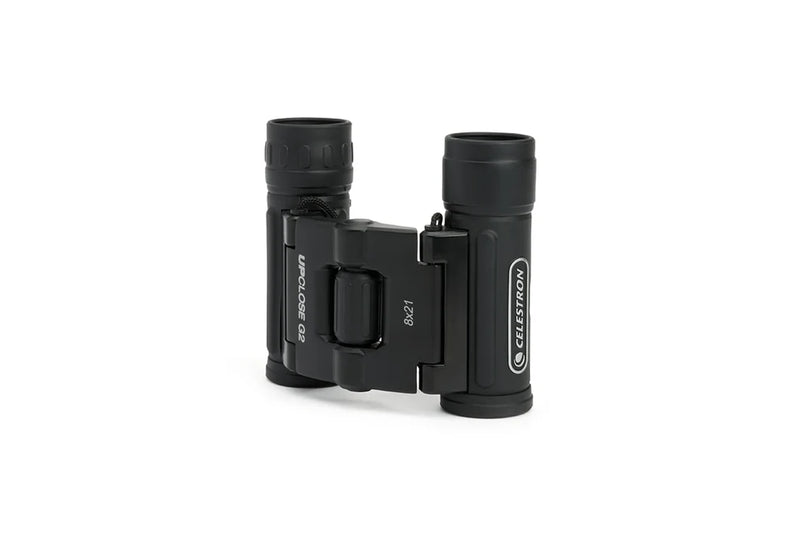 Celestron UpClose G2 8x21 roof binoculars with compact design, black body, and textured grip for clear outdoor viewing.