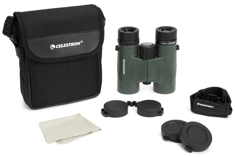 Celestron Nature DX 10x32 roof binoculars with black body and silver accents, showing close-up of eyepieces and focus wheel.