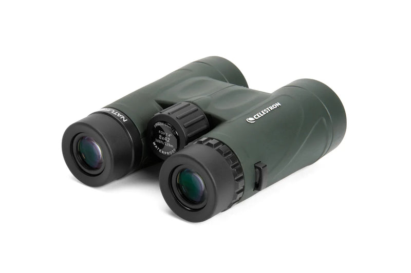 Celestron Nature DX Black 8x42 roof binoculars showing the compact design with black rubberized exterior and wide lenses.