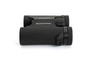 Celestron Outland X 8x25 Roof Binoculars shown from the side, compact black design with textured grip and lens details.