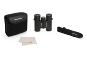 Celestron Outland X 10x25 roof binoculars showing compact design with black body and textured grips for outdoor viewing.