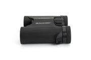 Celestron Outland X 10x25 roof binoculars showing compact design and rubber armoring for outdoor use.
