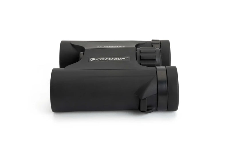 Celestron Outland X 10x25 roof binoculars showing compact design and rubber armoring for outdoor use.