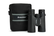Celestron Outland X 8x42 roof binoculars in a protective carrying case, featuring durable design and clear optics for outdoor viewing.