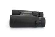 Celestron Outland X 8x42 roof binoculars showing the side view with large objective lenses and textured focus wheel.