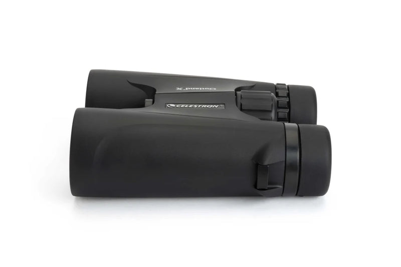 Celestron Outland X 8x42 roof binoculars showing the side view with large objective lenses and textured focus wheel.
