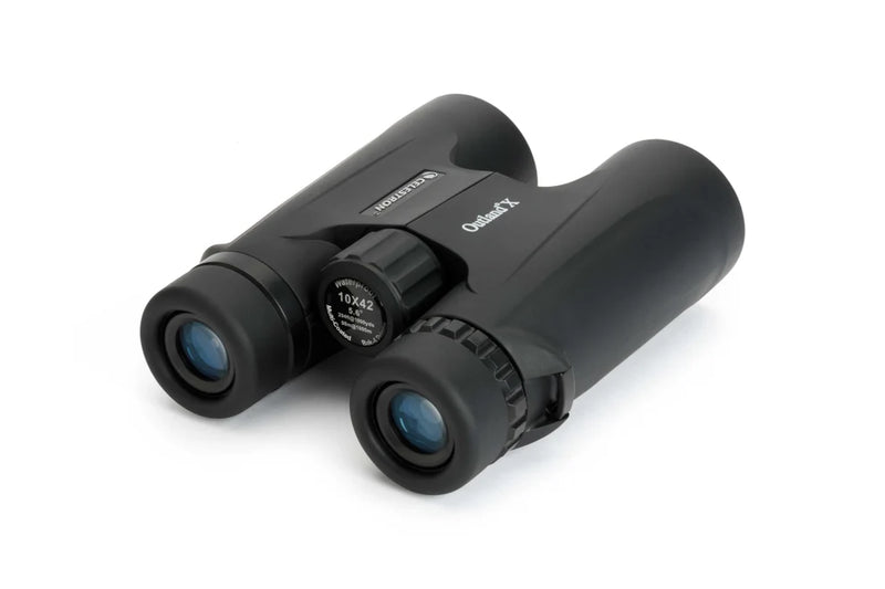 Celestron Outland X 10x42 binoculars showing the back view with textured grip and eyepieces, designed for outdoor birdwatching and nature viewing.