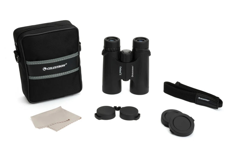 Celestron Outland X 10x42 roof binoculars with included accessories, showing the compact black binoculars and their lens details.