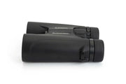 Celestron Outland X 10x42 roof binoculars with black body and textured grip, side view showing lenses and branding.