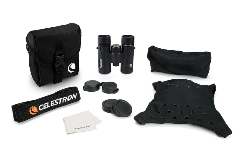 Celestron TrailSeeker ED 8x32 roof binoculars showing close-up of black and silver binoculars with textured grip and brand logo