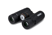 Celestron TrailSeeker ED 10x32 roof binoculars showing close-up of the black and silver binoculars with textured grip and lens details.