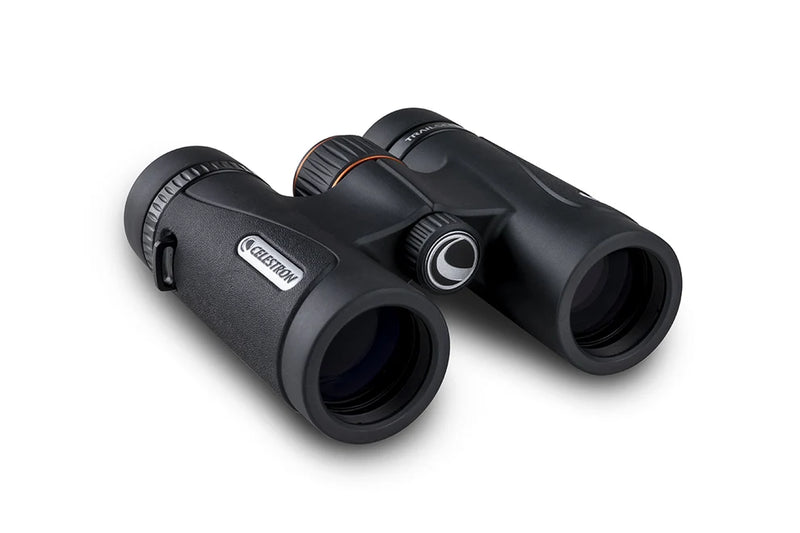 Celestron TrailSeeker ED 10x32 roof binoculars showing close-up of durable black and gray body with adjustable eyepieces.