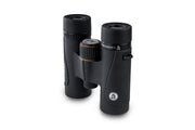 Celestron TrailSeeker ED 10x32 roof binoculars showing the compact design, eyepieces, and textured focus wheel for outdoor viewing.