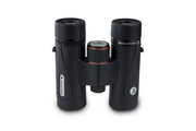 Celestron TrailSeeker ED 10x32 roof binoculars showing the compact design and textured grip for outdoor wildlife viewing.