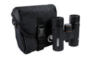 Celestron TrailSeeker ED 10x32 roof binoculars with compact design, showing the binoculars' close-up view and textured grip.