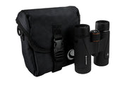 Celestron TrailSeeker 8x42 roof binoculars showing the compact design and textured rubber grip for outdoor wildlife viewing.