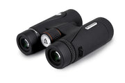 Celestron TrailSeeker ED 8x42 roof binoculars showing the black body, eyepieces, and textured focus wheel.