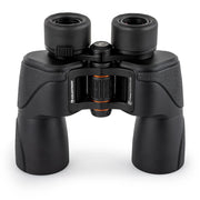 Celestron SkyMaster Pro ED 7x50 Porro binoculars showing large objective lenses and textured focus wheel for outdoor viewing