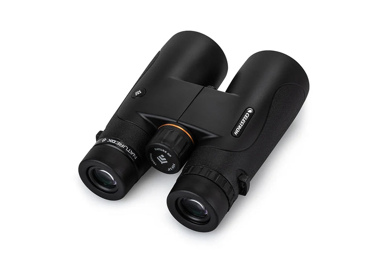 Celestron Nature DX black 10x50 roof binoculars showing the compact design and textured grip for outdoor wildlife observation.