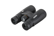 Celestron Nature DX 10x50 ED roof binoculars showing close-up of objective lenses and textured rubber armor for outdoor observation