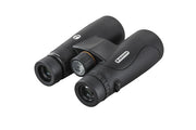 Celestron Nature DX 12x50 ED roof binoculars showing large objective lenses and textured body for outdoor birdwatching.