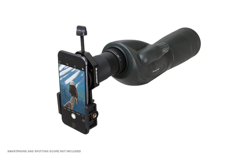 Celestron Basic Smartphone Adapter for telescopes, showing the black adapter device with smartphone attachment in close-up.