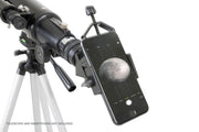 Celestron Basic Smartphone Adapter attached to a telescope, enabling smartphone photography of celestial objects.