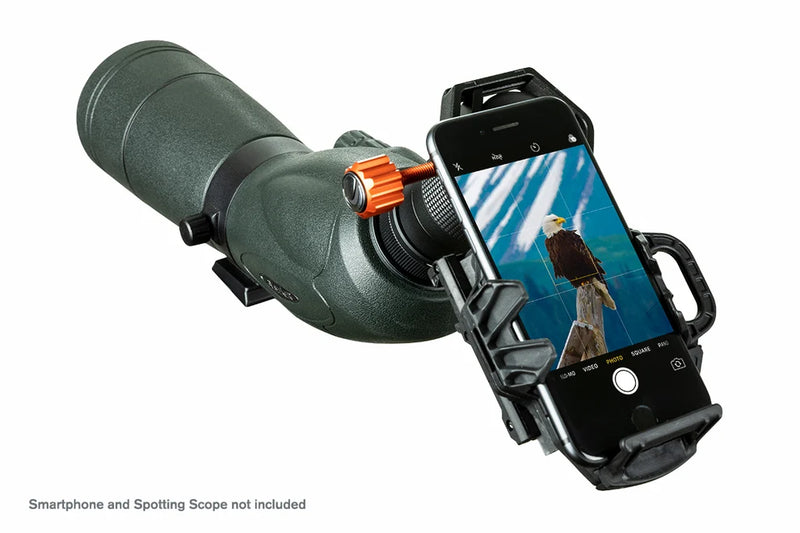 Celestron NeXGO 2-Axis Smartphone Adapter mounted on telescope, holding a smartphone for astrophotography or viewing.