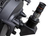 Celestron Omni 2x 1.25-inch Barlow lens for telescopes, showing the compact optical device with focusing rings