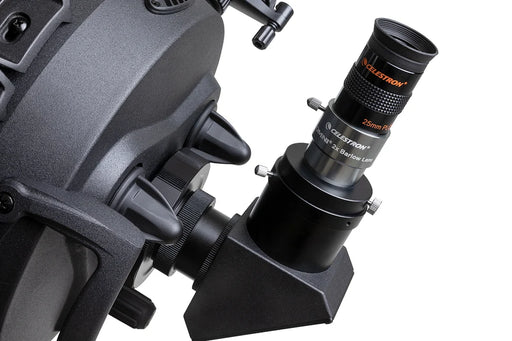 Celestron Omni 2x 1.25-inch Barlow lens for telescopes, showing the compact optical device with focusing rings