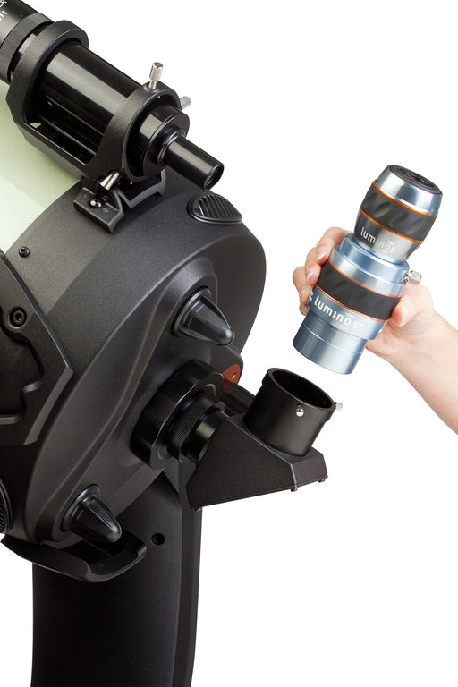 Celestron Luminos 2.5x 2" Barlow Lens for telescopes, shown with protective caps and packaging for eyepiece enhancement.