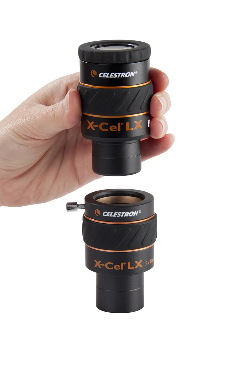Celestron 2x X-Cel LX Barlow lens for telescope eyepieces, showing the compact optical device with lens elements inside a metal barrel.