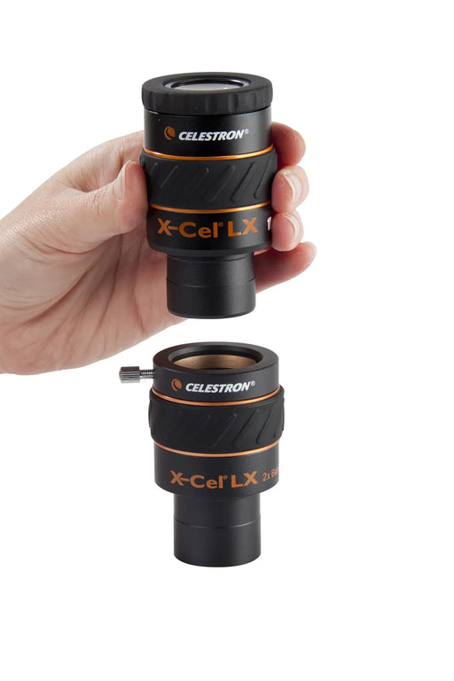 Celestron 2x X-Cel LX Barlow lens for telescope eyepieces, showing the compact optical device with lens elements inside a metal barrel.