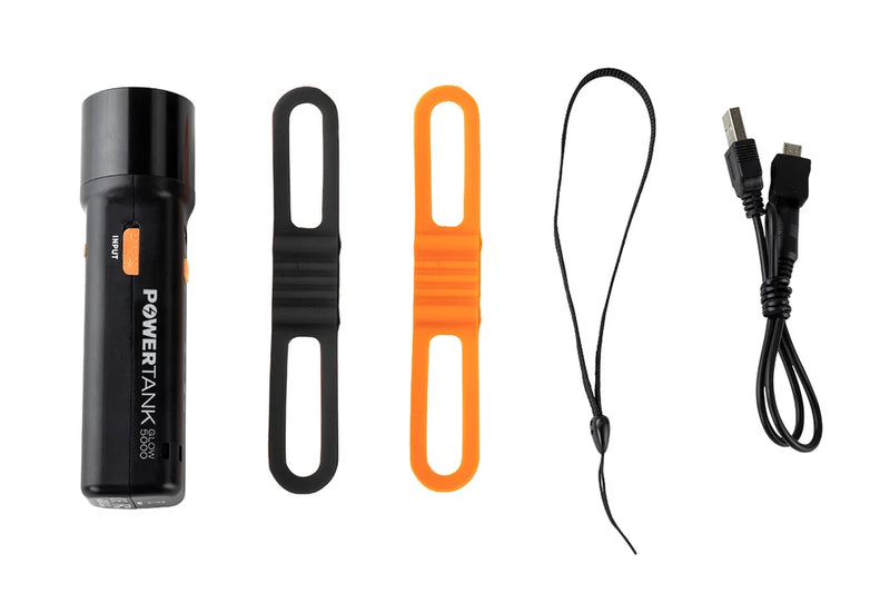 Celestron PowerTank Glow 5000 red flashlight and portable charger with LED light and power outlet for outdoor use.