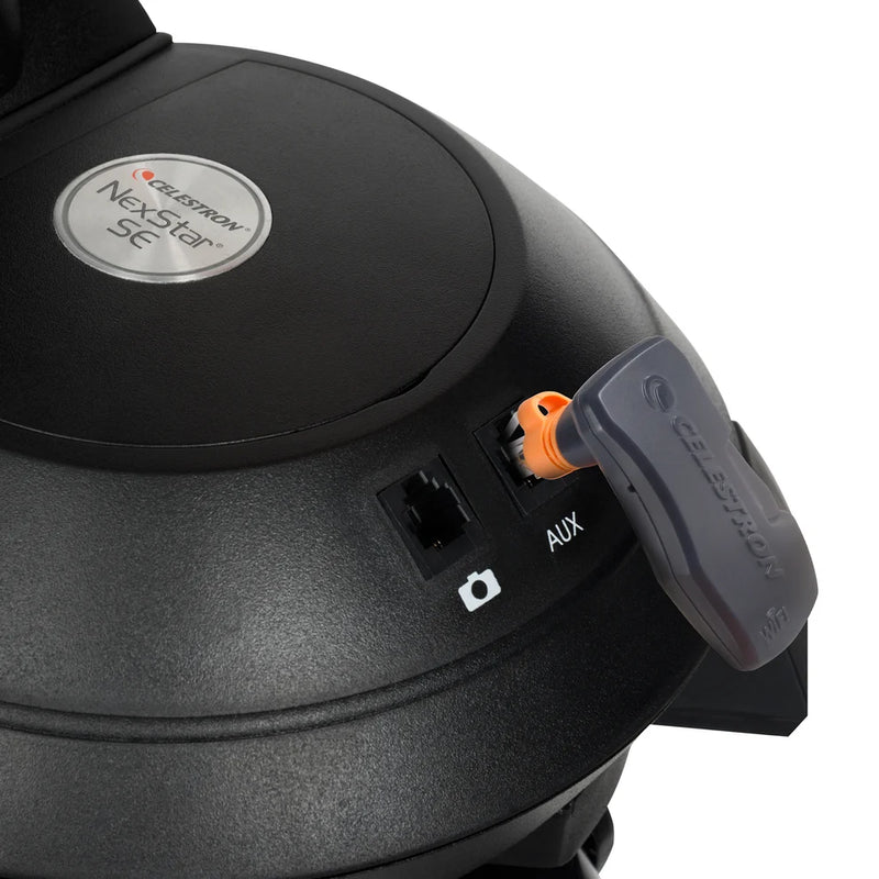 Celestron SkyPortal WiFi Module accessory for telescopes showing the compact device with WiFi connectivity.