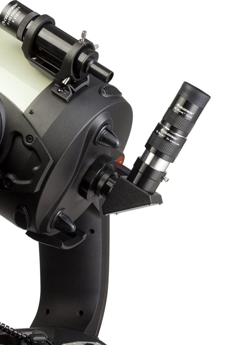 Celestron 2-inch eyepiece and filter kit with various lenses and filters for telescope accessories, mounted for viewing.